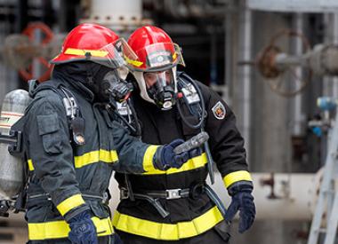 Two Royal Dutch Shell Refinery Firemen doing a safety check