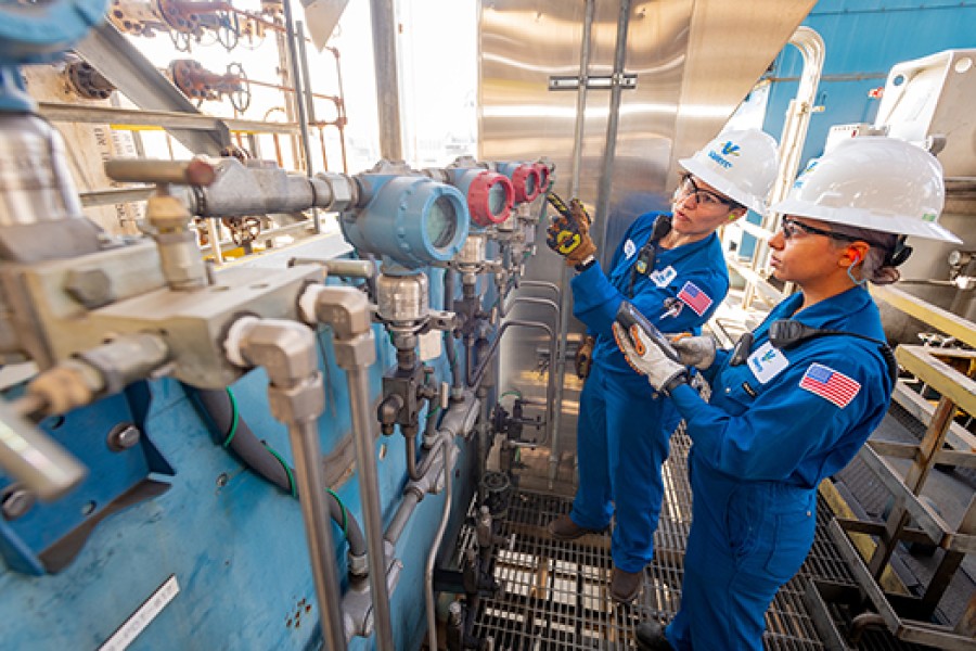 Two female Royal Dutch Shell refinery employees