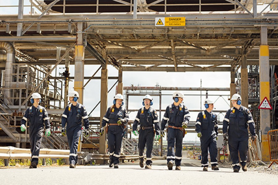 Engineers walk together at Royal Dutch Shell's Pembroke Refinery.
